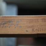 pieczątka Stefan Kłos Kalisz 77 rok na boku klawiszu pianina